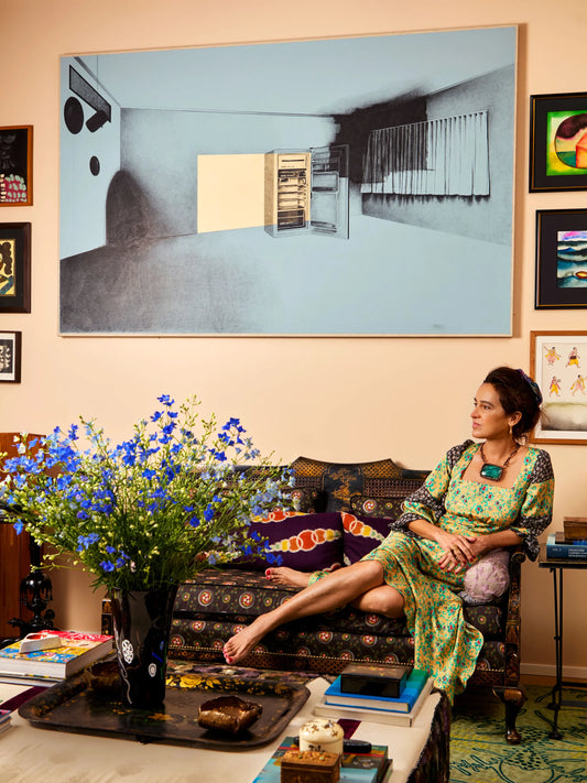 Interior of Coco Brandolini d'Adda's Milan apartment featuring vintage furniture, textiles and collected objects