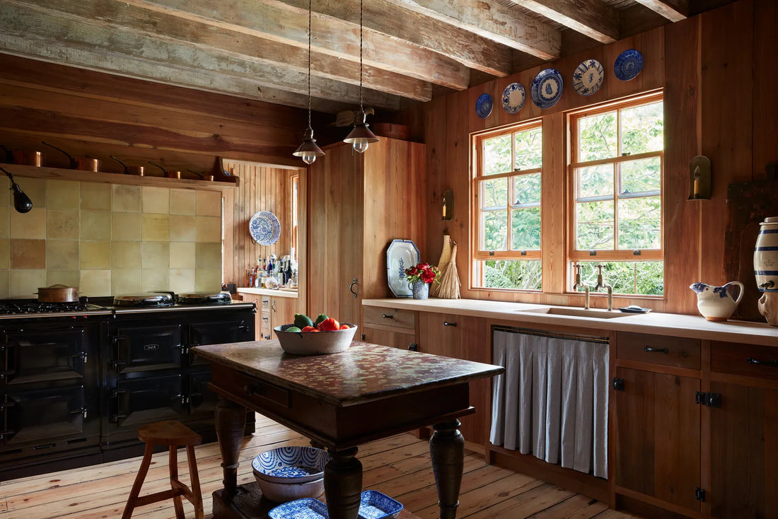 Layered interior with vintage and contemporary furniture mixed together, warm natural materials and soft autumn light