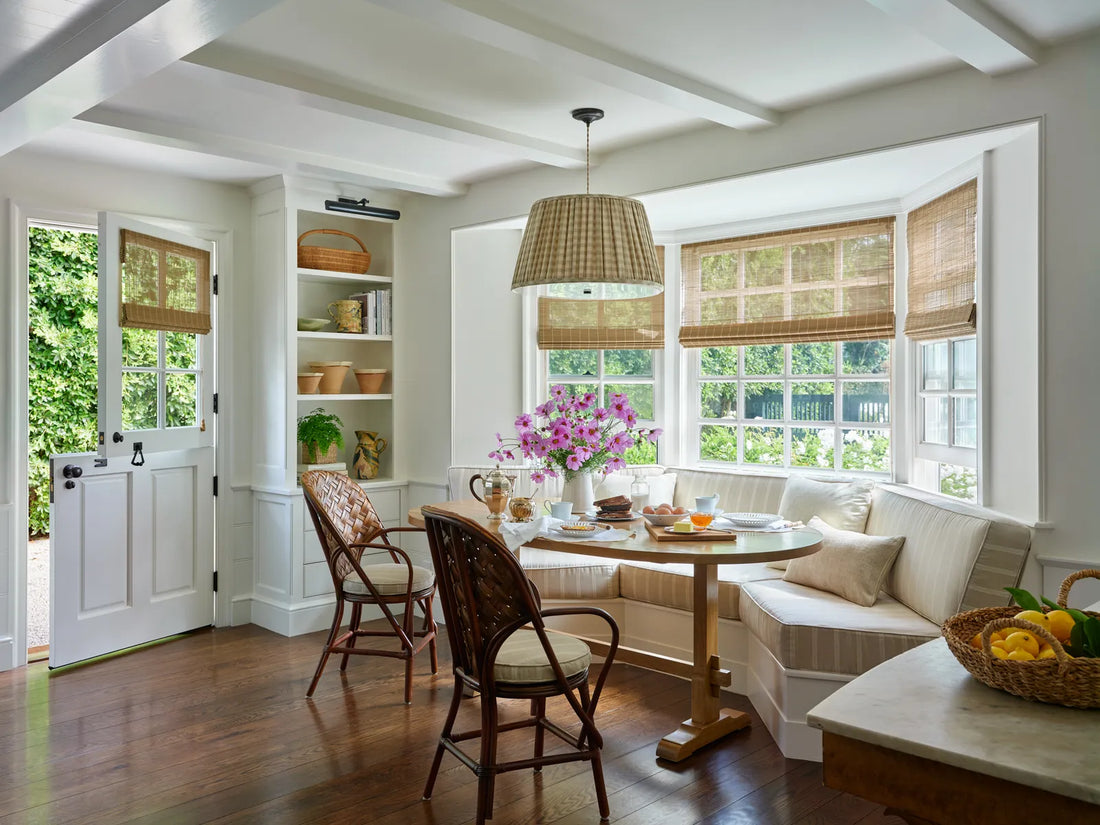 Warm, layered kitchen interior with natural materials and soft lighting in the Nancy Meyers style